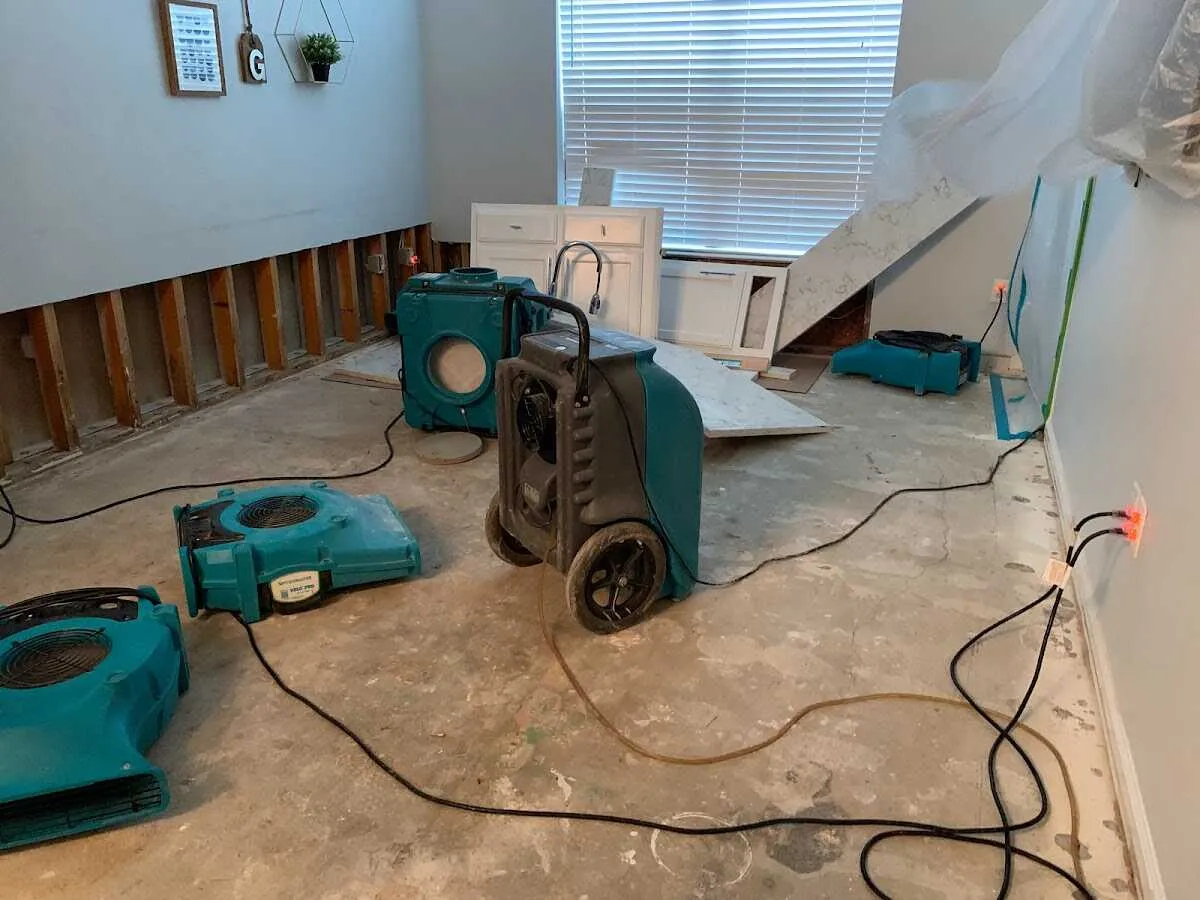 Dehumidifier in flood-cut room for Water Damage Restoration in Cadillac